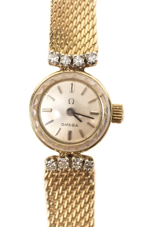 14k gold omega ladies watch.